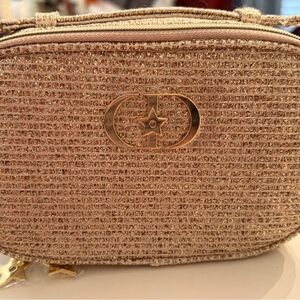 Dior Gold handle bag with premium Dior skincare items